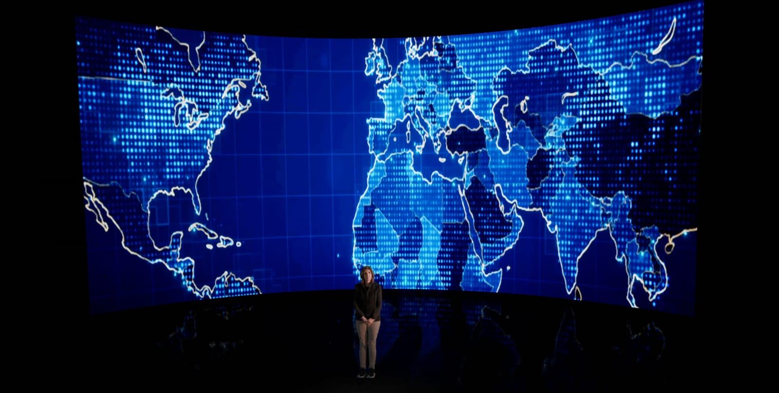 Talent standing in front of a virtual curved LED screen created in Unreal Engine at L.A. & ABQ Castle Studios