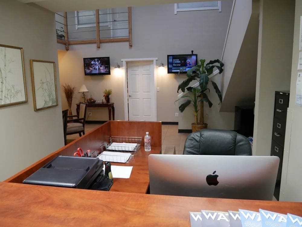 The front desk and lobby at the Burbank studio, with the mezzanine above