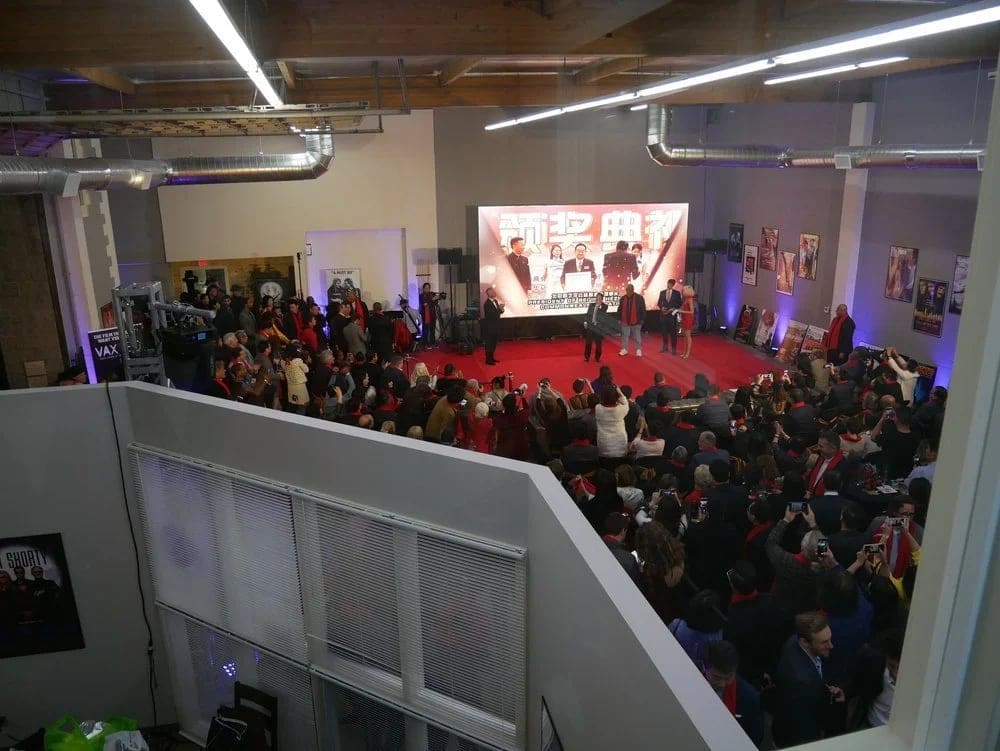 The Burbank studio's common area seen from the mezzanine during an evening awards event, with the giant LED video village wall behind the stage