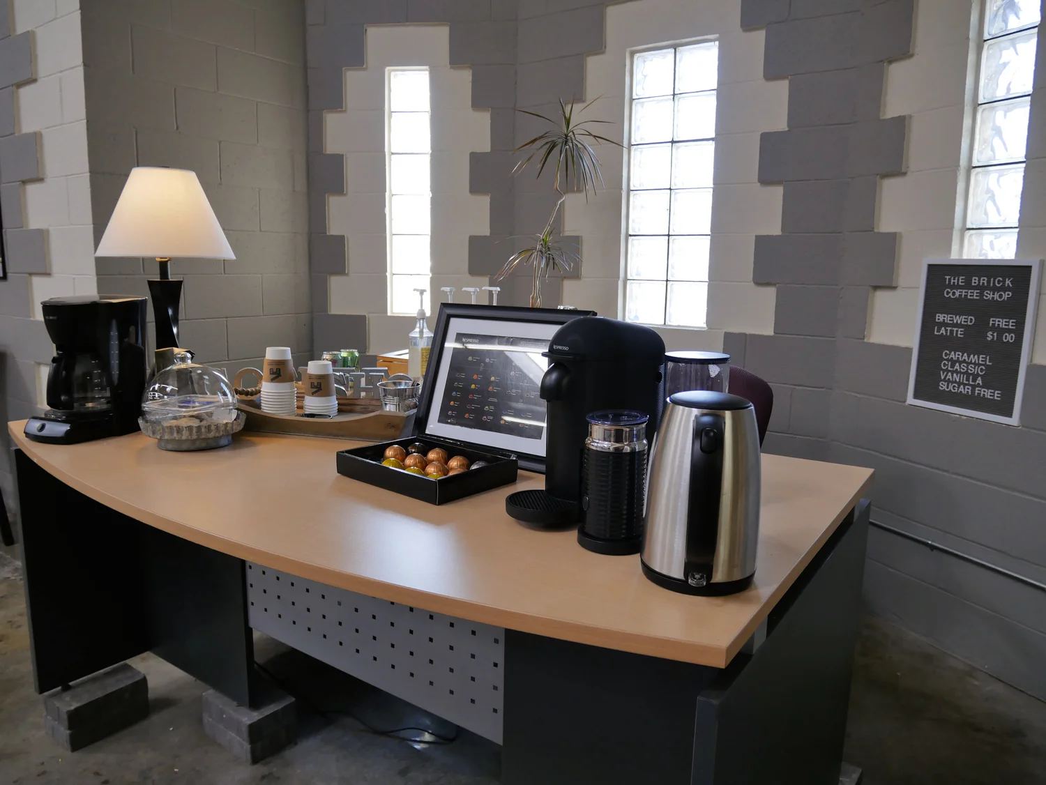 The in-house coffee station in the Burbank production offices, 'The Brick Coffee Shop', with a Nespresso machine and free brewed coffee.