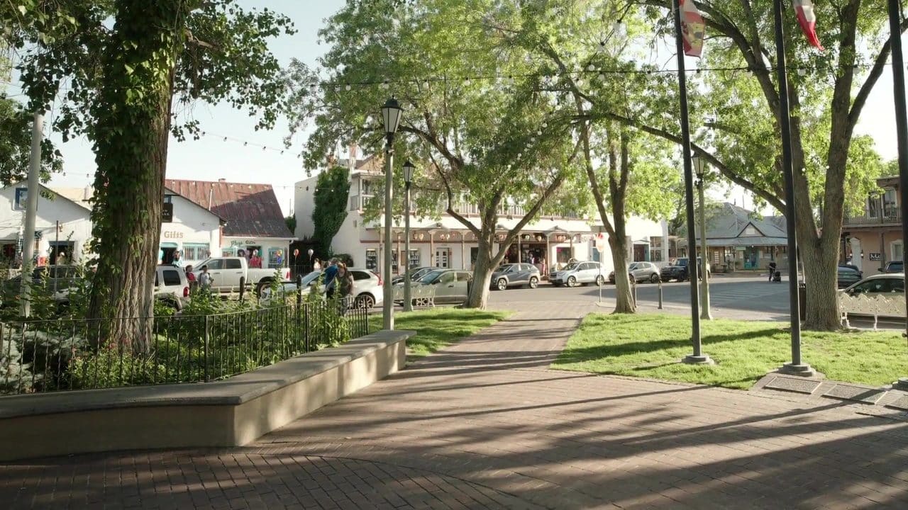 The Old Town Albuquerque plaza with trees, benches and parked cars, the real place captured with CastleVision