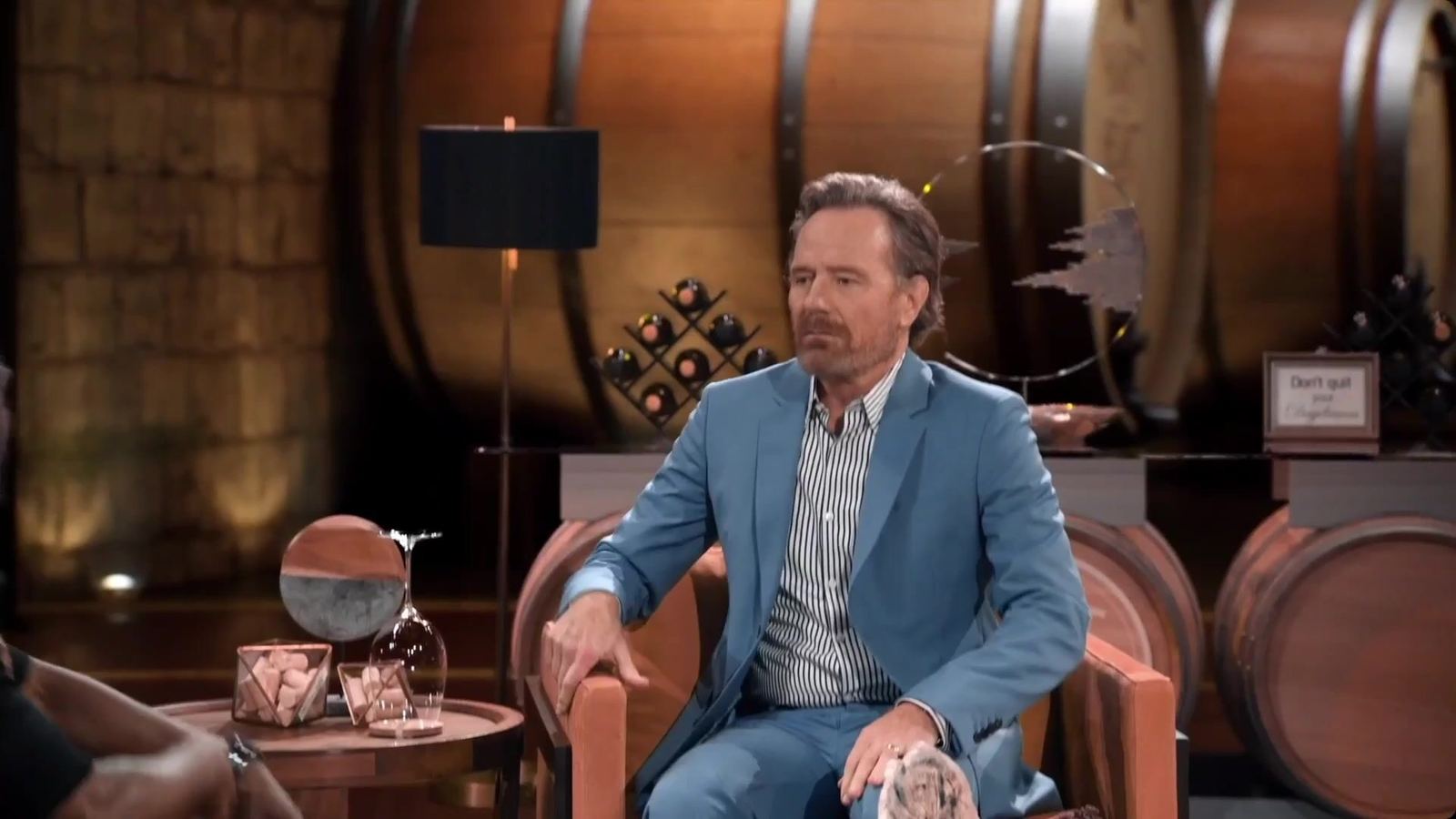 Bryan Cranston on Hart to Heart in a wine cellar virtual set, shot in camera at the L.A. Castle Studios production studio in Burbank