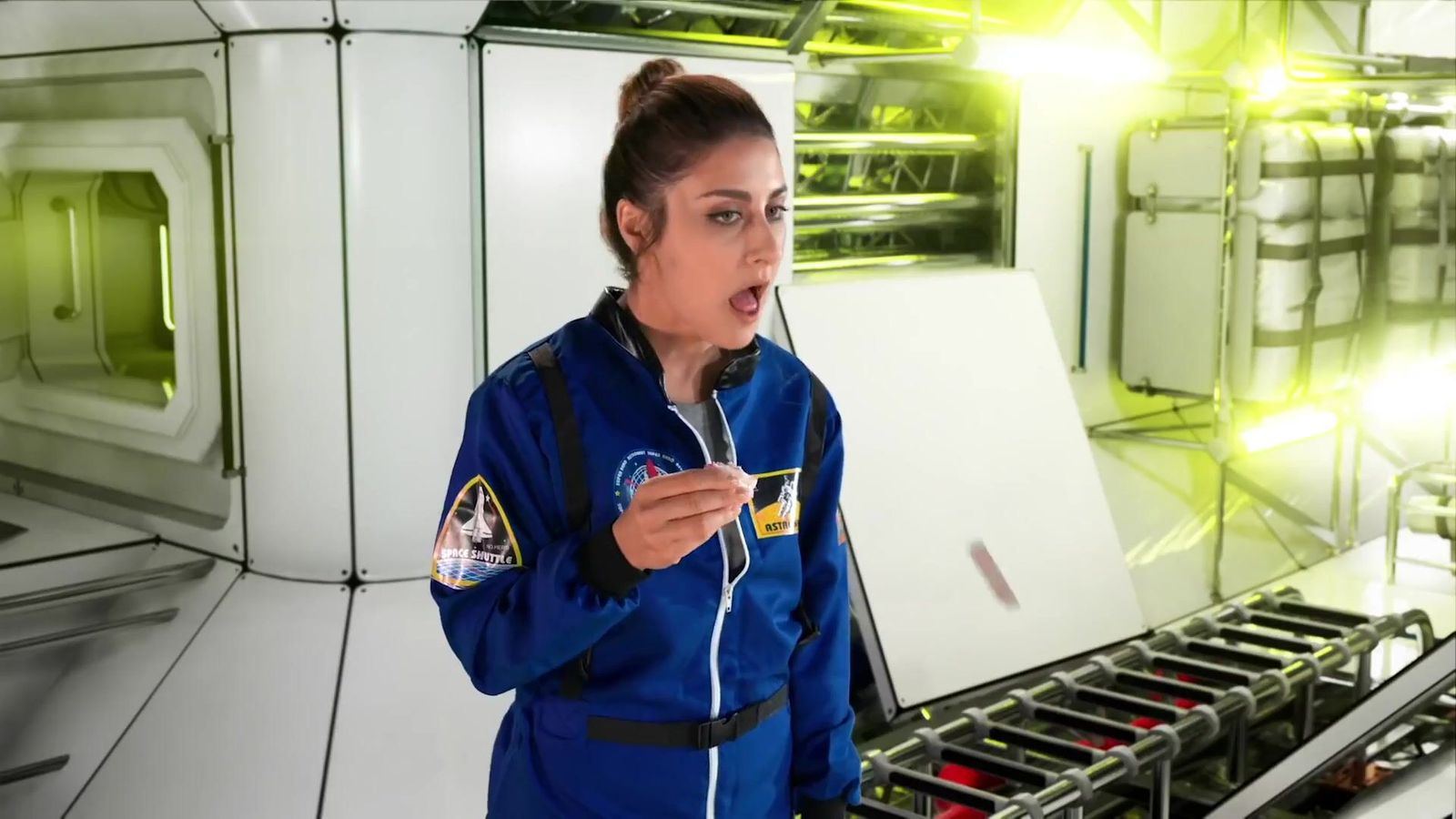 Commercial: an actor in a blue flight suit inside a white spaceship module, a sci-fi commercial set at L.A. & ABQ Castle Studios