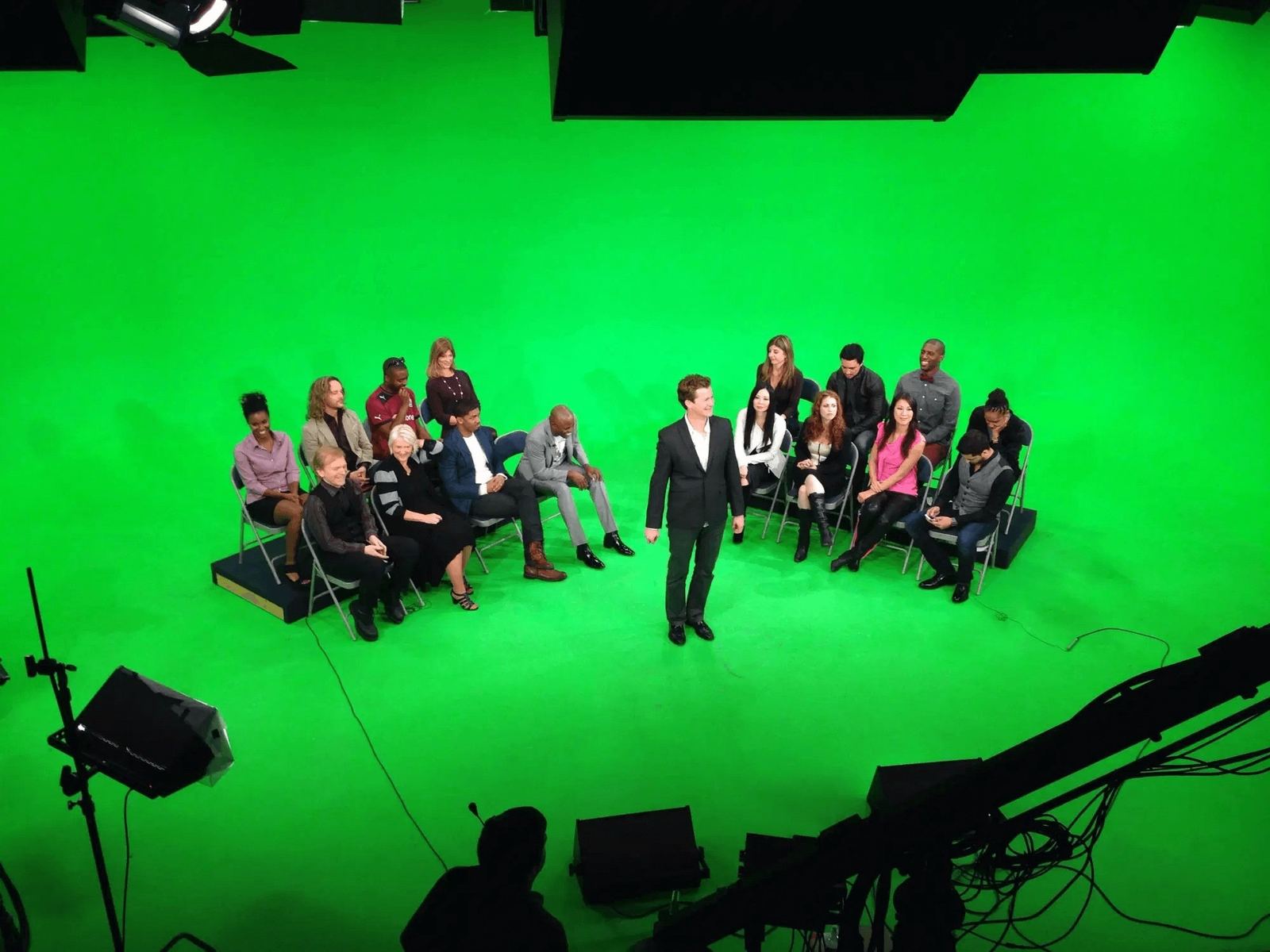 Game show production — overhead of a studio audience seated on a green screen stage as a host addresses them at L.A. & ABQ Castle Studios