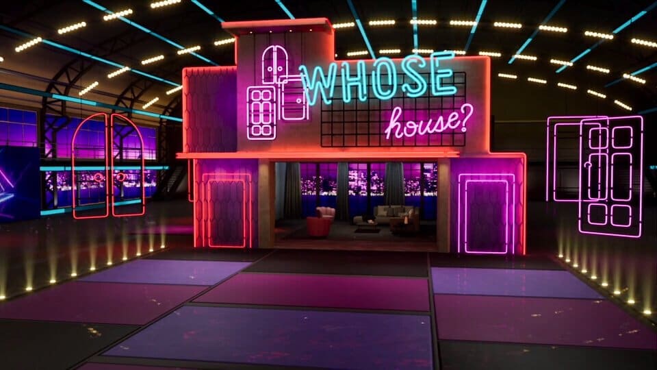 Game show set — a neon-outlined house facade glowing pink and teal over a lit floor, a virtual production set at L.A. & ABQ Castle Studios