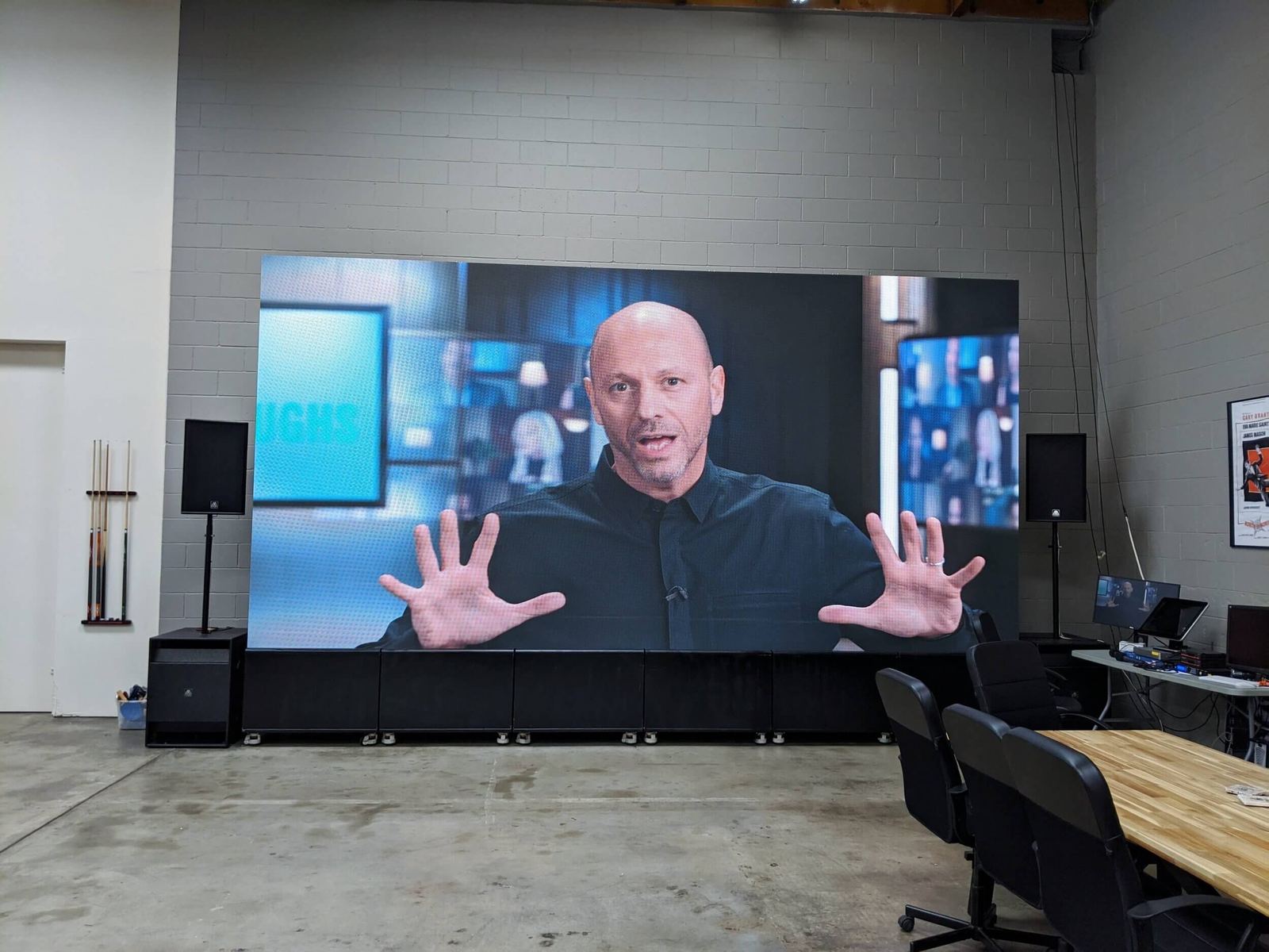 Host wrap: a presenter on the giant LED video village wall at the L.A. Castle Studios Burbank studio