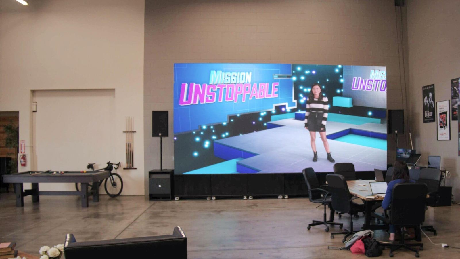 Host wrap: wide view of the 'Mission Unstoppable' set on the Burbank studio's giant LED video village wall