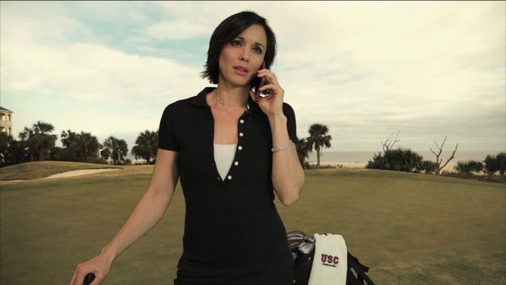 An actor on the phone on a seaside golf course virtual set, a series scene shot at L.A. Castle Studios