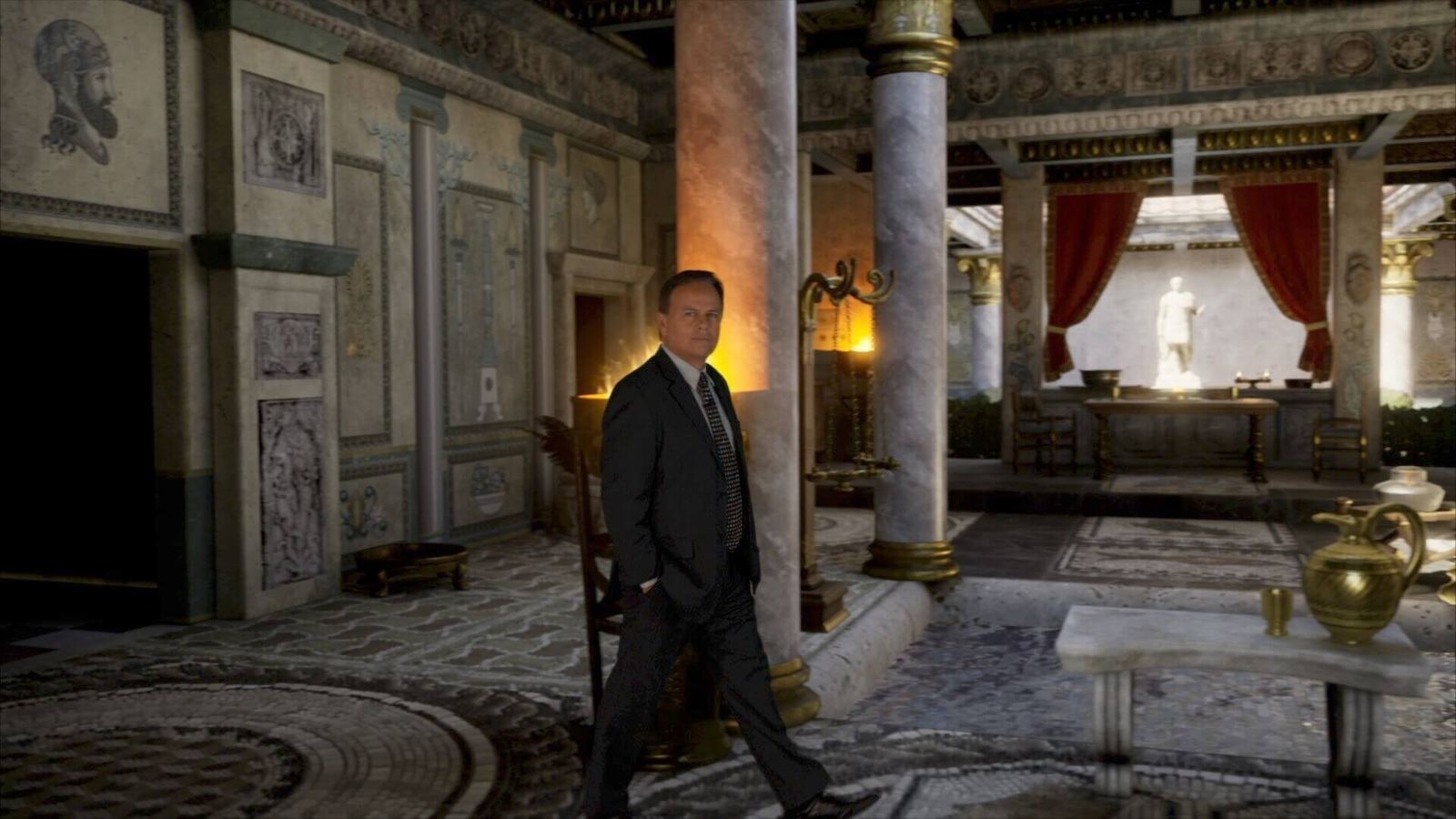 TV and film set: a man in a suit walks through an ornate ancient Roman villa with marble columns, an Unreal Engine virtual production set at L.A. & ABQ Castle Studios